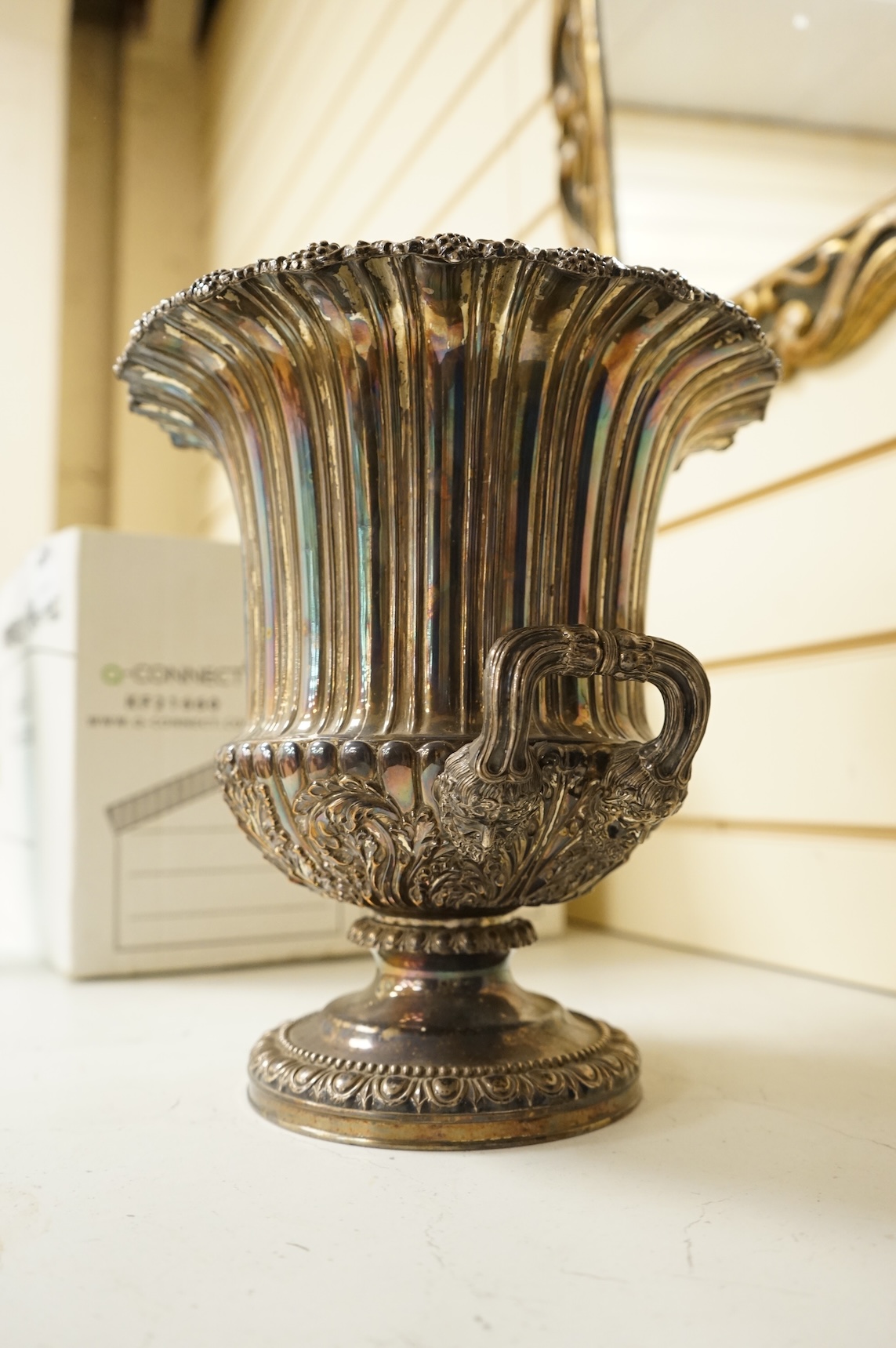 A Victorian silver plated campana wine cooler and removable liner, with vineous cast rim and bacchic mask twin handles, height 26cm.